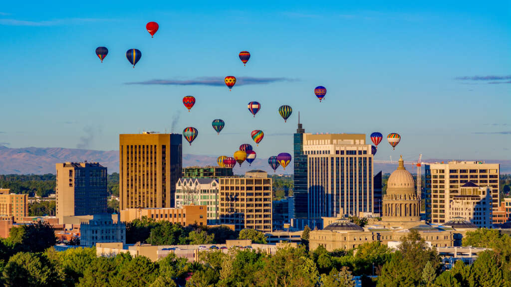Hot air balloons take flight over the little town of Boise Idaho