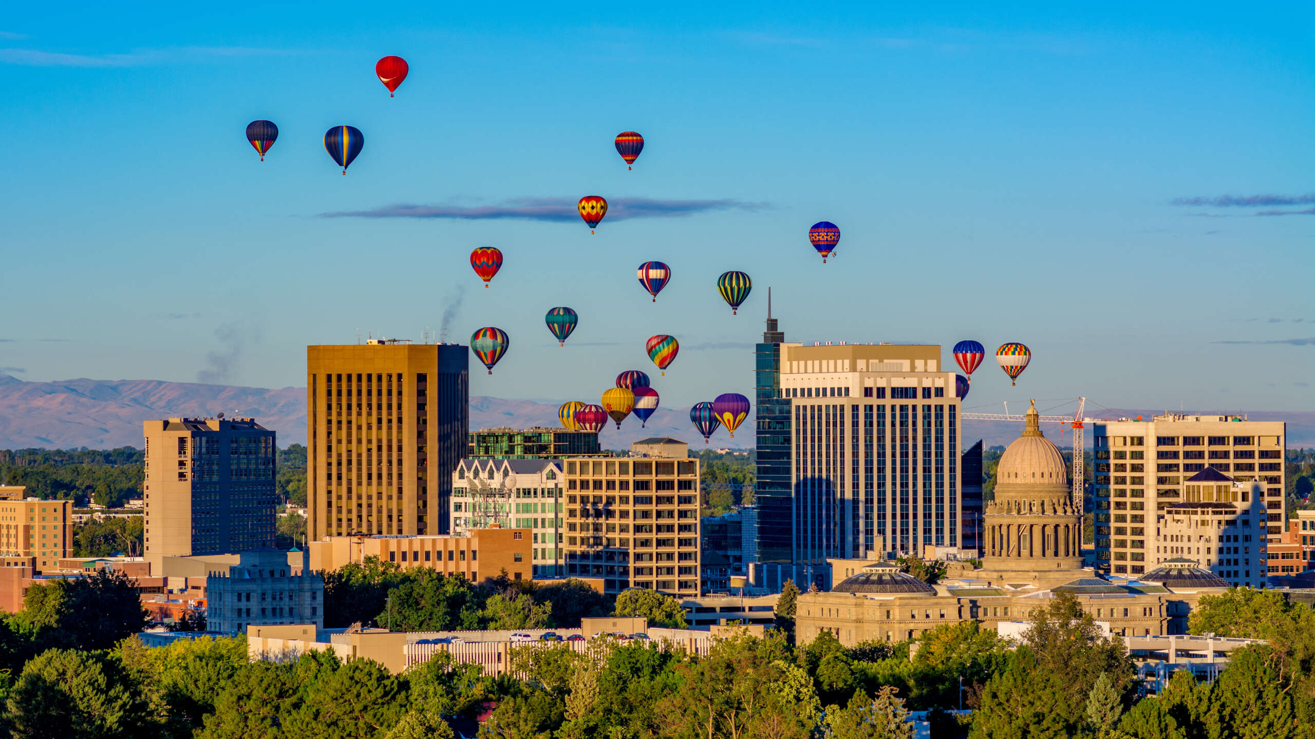 Hot air balloons take flight over the little town of Boise Idaho